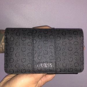 Guess wallet. Gun metal gray and In good condition.